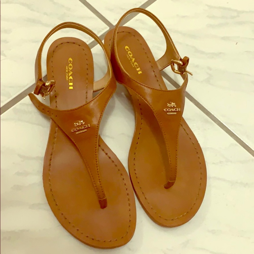 Coach tan leather sandals with one inch heels.
